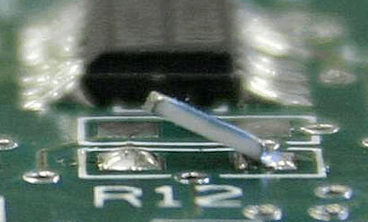 A component on a circuit board that has the tombstone defect